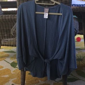 Soft, and comfy front tie high-low sweater.